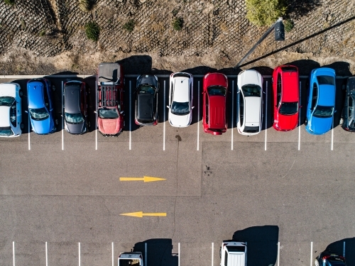 Aerial shot of cars parked in carpark with empty spaces - Australian Stock Image