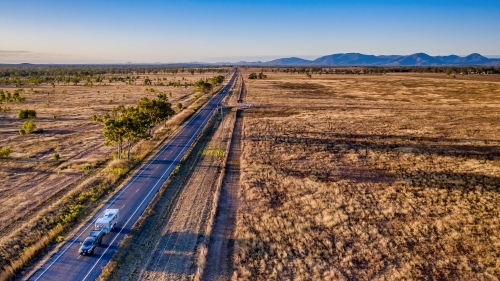 Aerial view caravan, bushland and highway of Mount Morgan during day time - Australian Stock Image