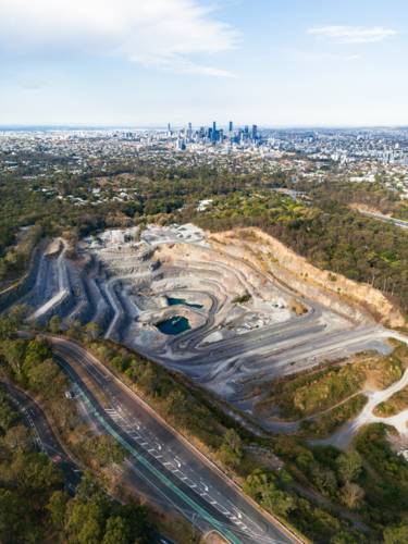 Aerial view of a quarry at Mount Coot-tha in close proximity to the city - Australian Stock Image