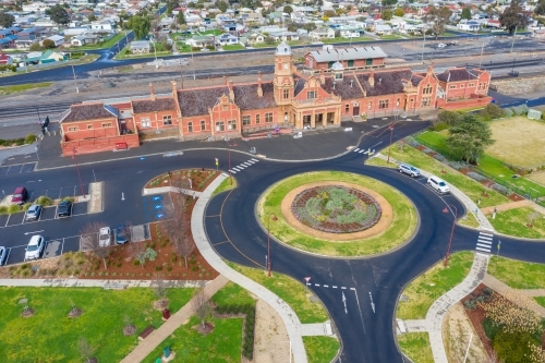 Aerial view of an historic railway station near a roundabout - Australian Stock Image