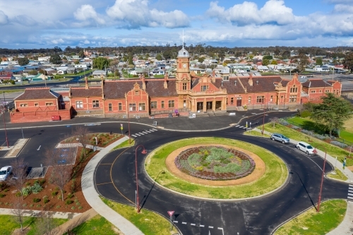 Aerial view of an historic railway station near a roundabout - Australian Stock Image