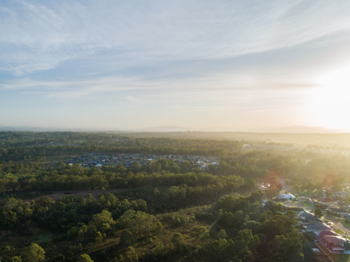 Aerial view of edge of town where bush meets developed land in Singleton - Australian Stock Image