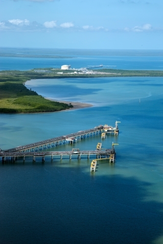 Aerial view of industrial wharves in harbour - Australian Stock Image