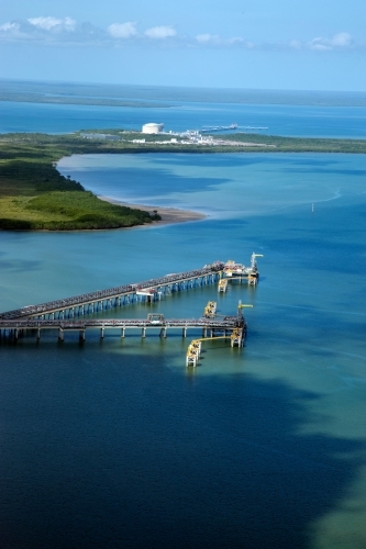 Aerial view of industrial wharves in harbour - Australian Stock Image