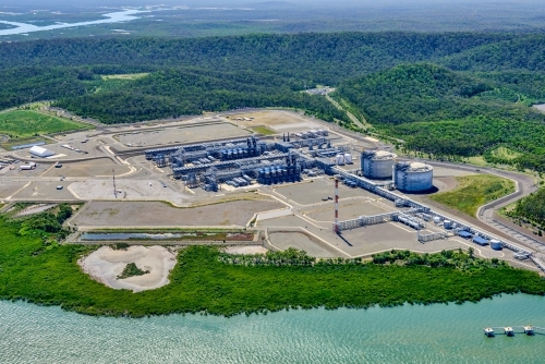 Aerial view of liquified natural gas plant and LNG ship on Curtis Island, Queensland - Australian Stock Image