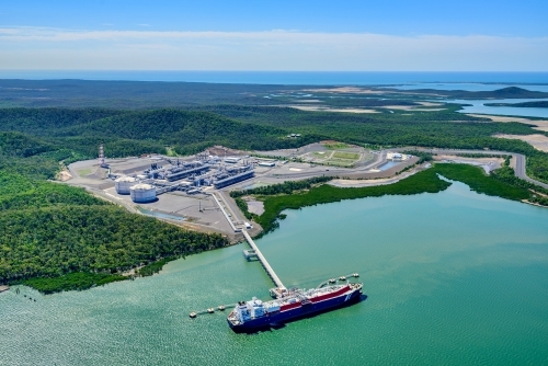 Aerial view of liquified natural gas plant and LNG ship on Curtis Island, Queensland - Australian Stock Image