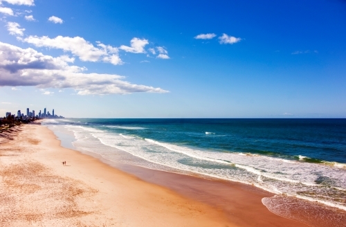Aerial view of lone couple on Gold Coast beach - Australian Stock Image