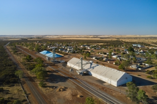 Aerial view of small country town of Ballidu in WA, with the CBH bins and railway in the foreground.