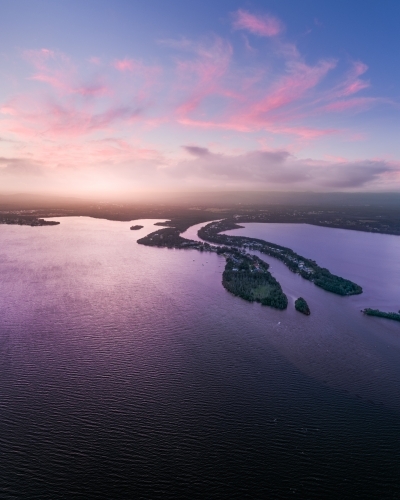 Aerial view of sunset over Dora Creek and Eraring on Lake Macquarie on the NSW Central Coast - Australian Stock Image