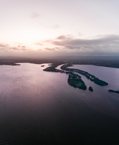 Aerial view of sunset over Dora Creek and Eraring on Lake Macquarie on the NSW Central Coast - Australian Stock Image