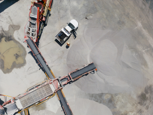 Aerial view of the quarry with machineries. - Australian Stock Image