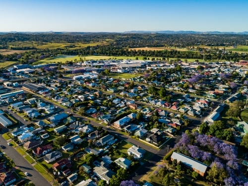 aerial view over town houses to shops parkland and river - Australian Stock Image
