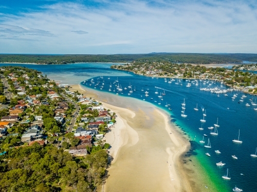 Aerial views of Gunnamatta beach and water views with the many luxury yachts and boats moored