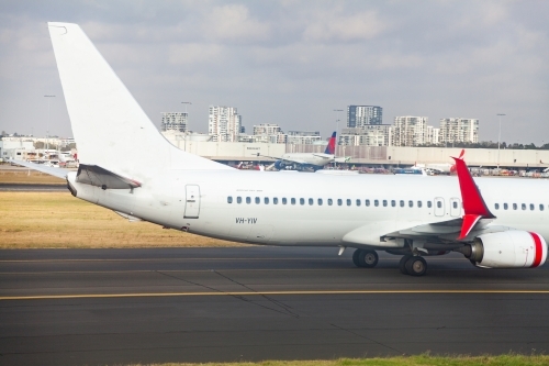 Aeroplane on runway at air port Sydney - Australian Stock Image