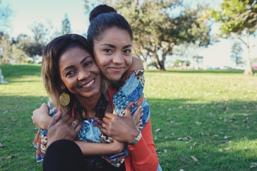 African mother and multicultural teen daughter - Australian Stock Image