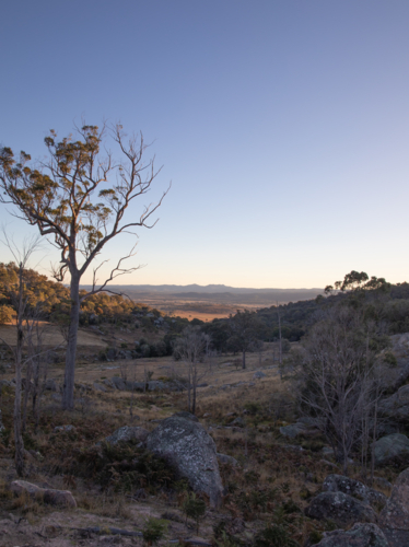 An early morning overlooking a shadowed valley - Australian Stock Image