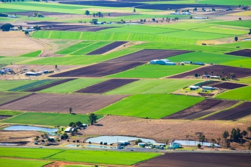 An elevate view of agricultural fields of green and dark brown colour around the area of Kalbar - Australian Stock Image