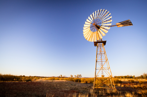 An old disused windmill at dawn near Gemtree, Northern Territory, Australia - Australian Stock Image