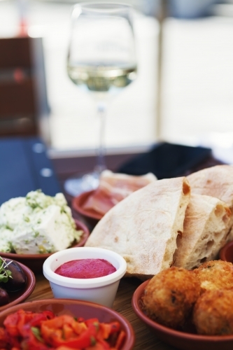 Antipasto platter of bread dips and arancini balls - Australian Stock Image