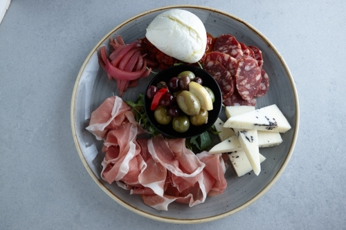 Antipasto platter on plate - Australian Stock Image