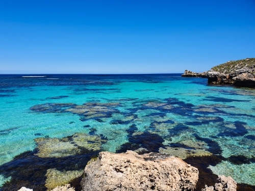 Aqua blue bay with coral on Rottnest Island - Australian Stock Image