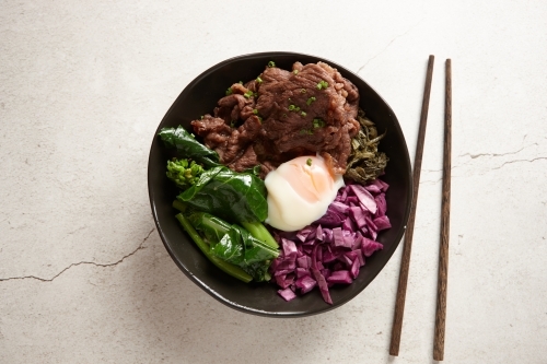 Asian beef soup ingredients in bowl - Australian Stock Image