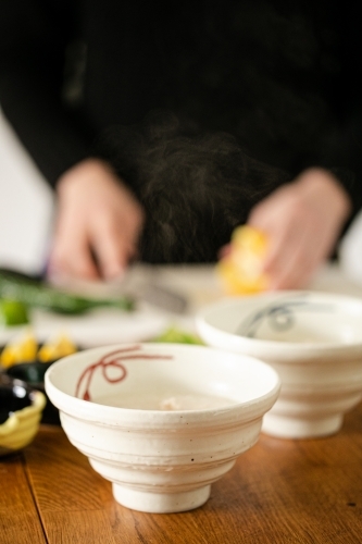 Asian style bowls filled with congee - Australian Stock Image