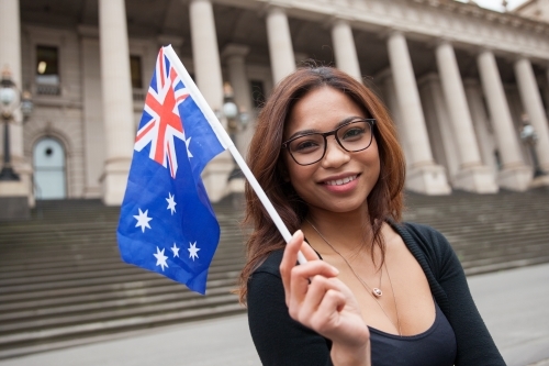 Asian Woman Waving An Australian Flag - Australian Stock Image