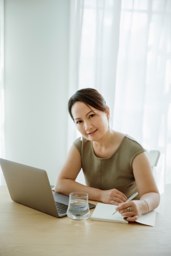 Asian woman working on a computer