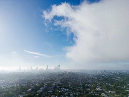 Atmospheric aerial view of the Brisbane city from the northern suburb of Ashgrove - Australian Stock Image