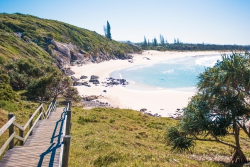 Australian coastline with wooden pathway leading down to beach. - Australian Stock Image