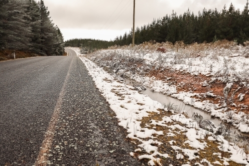 Australian country roads during snowy winter season at Shooters Hill, NSW - Australian Stock Image