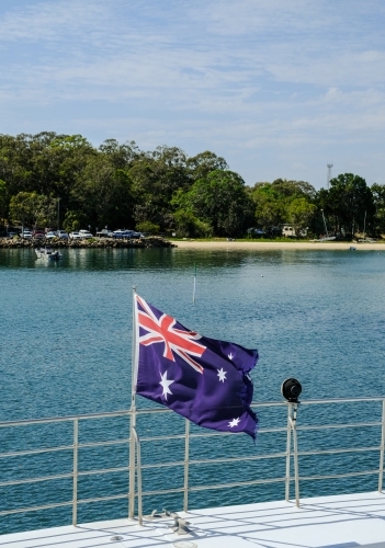 Australian flag on boat arriving at Dunwich - Australian Stock Image