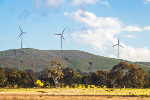 Australian sustainable energy wind turbines in rural Victoria viewed from the highway - Australian Stock Image