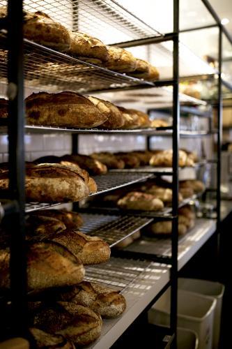 Bakery racks of fresh bread - Australian Stock Image