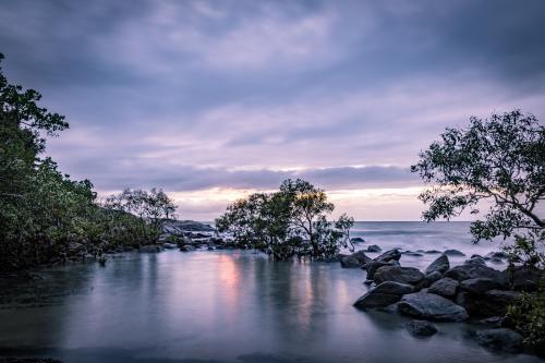 Beach Lagoon with moody sky - Australian Stock Image