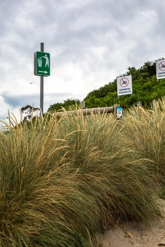 Beach signs in the dune grass - Australian Stock Image