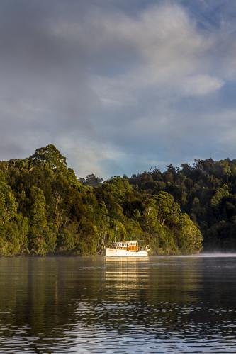 Beautiful old wooden boat on the water - Australian Stock Image