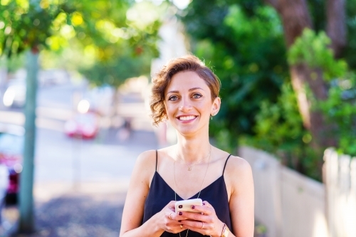 beautiful woman with phone - Australian Stock Image