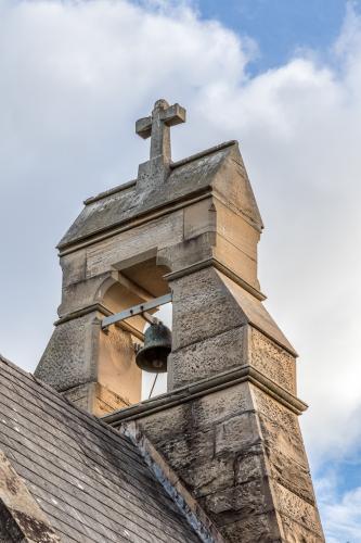 Bell and cross on top of church - Australian Stock Image