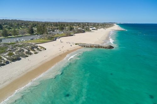 Bird's eye view of the clear water and sandy beach at City Beach in Perth, Western Australia. - Australian Stock Image