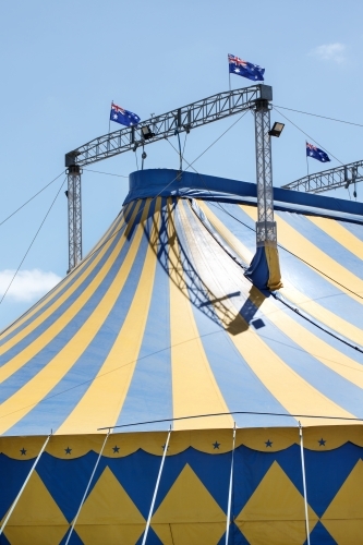 Blue and yellow circus tent with australian flag - Australian Stock Image