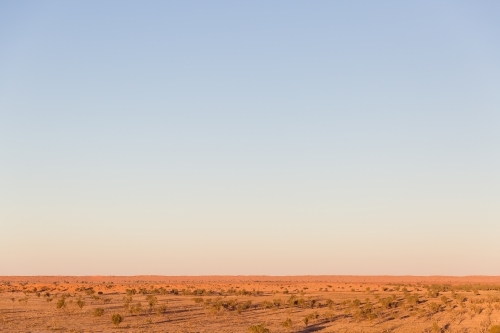 Blue sky and red dirt in outback australia - Australian Stock Image