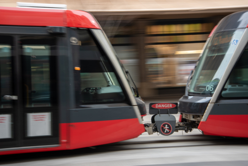 Blurred motion of light rail train on George Street, Sydney - Australian Stock Image