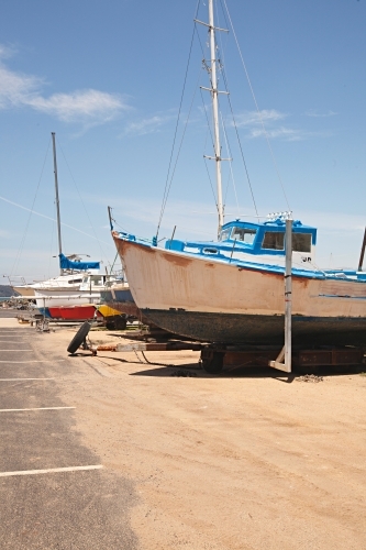 Boat on dry land awaiting repairs in New South Wales - Australian Stock Image