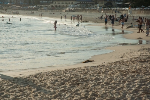Bondi Beach late afternoon with people strolling - Australian Stock Image