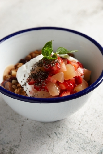 Bowl of muesli with yoghurt and fruit - Australian Stock Image