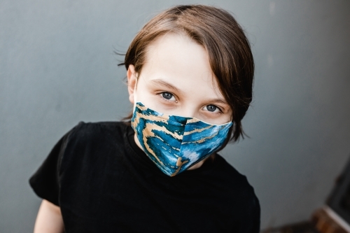 boy child wearing fabric masks during the corona COVID-19 pandemic, masks are now compulsory. - Australian Stock Image