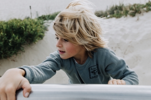 Boy climbing - Australian Stock Image