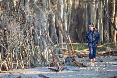 Boy exploring the remote coast of Queensland - Australian Stock Image